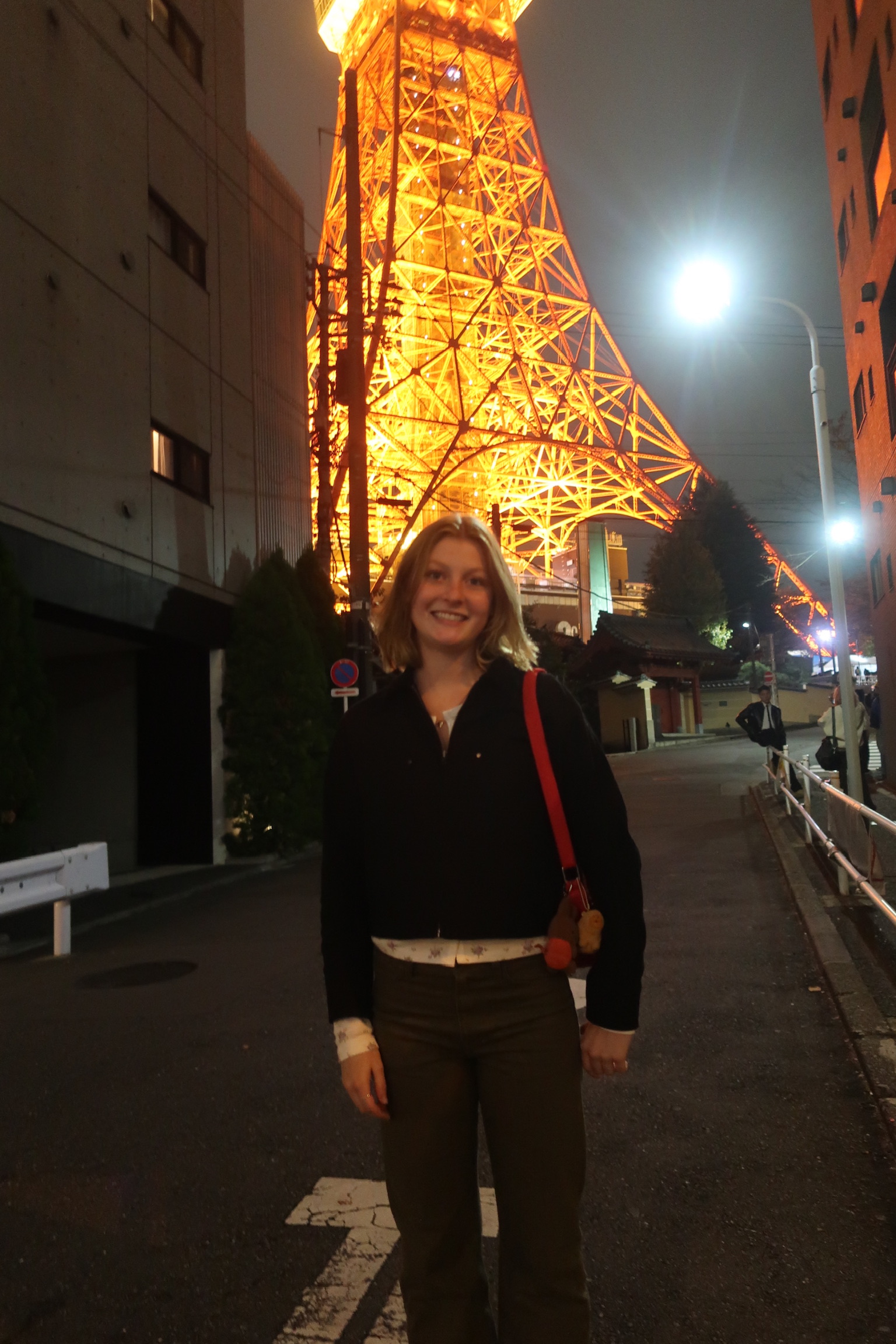 Grace Allott standing in front of the Tokyo Tower